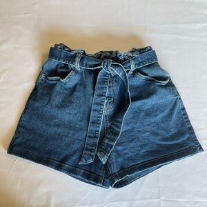 High waisted paper bag blue Jean shorts. In good condition.